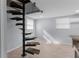 Unique spiral staircase leading to an upstairs bonus room with natural light at 15193 Copeland Way, Brooksville, FL 34604