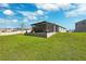 Expansive backyard featuring a screened-in patio and tasteful landscaping at 15793 Midnight Dove Ct, Odessa, FL 33556