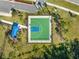 An aerial view of an outdoor basketball court with green and blue surfaces and a covered shelter at 15793 Midnight Dove Ct, Odessa, FL 33556