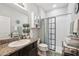 Bathroom featuring a vanity with granite countertop and a glass-enclosed shower at 15793 Midnight Dove Ct, Odessa, FL 33556
