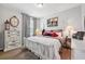 Charming bedroom featuring a four-poster bed, wood floors, and decorative accents at 15793 Midnight Dove Ct, Odessa, FL 33556
