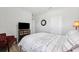 Cozy bedroom featuring neutral tones, a comfortable bed, and a mounted television at 15793 Midnight Dove Ct, Odessa, FL 33556