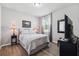 Serene bedroom features a comfortable bed, bedside lamps, and a mounted television at 15793 Midnight Dove Ct, Odessa, FL 33556