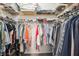 Walk-in closet with ample storage space, shelving, and hanging racks at 15793 Midnight Dove Ct, Odessa, FL 33556