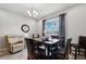 Bright dining area with stylish furniture, a large window, and plenty of natural light at 15793 Midnight Dove Ct, Odessa, FL 33556