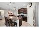 Gourmet kitchen with granite countertops, stainless steel appliances, and a large island with seating at 15793 Midnight Dove Ct, Odessa, FL 33556