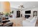 Living room with tile flooring and sliding glass doors that lead to an outdoor patio at 15793 Midnight Dove Ct, Odessa, FL 33556