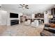 Bright open-concept living room showcasing tile floors and views to the dining area and kitchen at 15793 Midnight Dove Ct, Odessa, FL 33556