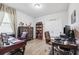 This office features an executive desk, wood floors, and a stylish bookshelf at 15793 Midnight Dove Ct, Odessa, FL 33556