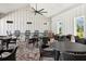 Covered patio with ample seating, including tables, chairs, and bar stools at 15793 Midnight Dove Ct, Odessa, FL 33556
