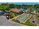 Aerial view of the community, pool, and shuffleboard courts at 1737 Pine Ridge W Way # B-1, Palm Harbor, FL 34684