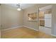 View of the dining room and passthrough to the kitchen, featuring wood cabinets at 1737 Pine Ridge W Way # B-1, Palm Harbor, FL 34684