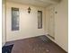 Covered condo entrance with light fixture and view of door number 81 at 1737 Pine Ridge W Way # B-1, Palm Harbor, FL 34684