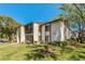 Exterior shot of condo building shows unit number 1737 and second story balconies at 1737 Pine Ridge W Way # B-1, Palm Harbor, FL 34684