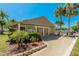 Exterior of the Pine Ridge clubhouse surrounded by lush tropical landscaping at 1737 Pine Ridge W Way # B-1, Palm Harbor, FL 34684