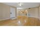 Open floor plan living room with pass through to the kitchen area with wood cabinetry at 1737 Pine Ridge W Way # B-1, Palm Harbor, FL 34684