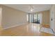 Spacious living room with ceiling fan, neutral paint and sliding doors to the outside at 1737 Pine Ridge W Way # B-1, Palm Harbor, FL 34684