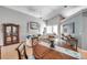 Spacious living room with natural light, comfortable seating, and an open layout with vaulted ceilings at 1783 Wood Brook St, Tarpon Springs, FL 34689