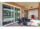 Relaxing covered patio featuring outdoor furniture and access to the in-ground swimming pool at 1783 Wood Brook St, Tarpon Springs, FL 34689