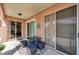 Relaxing covered patio featuring outdoor furniture and access to the in-ground swimming pool at 1783 Wood Brook St, Tarpon Springs, FL 34689