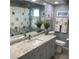 Stylish bathroom with white cabinets, granite countertop, and decorative shower curtain at 18345 Hottelet Cir, Port Charlotte, FL 33948