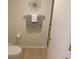 Bright bathroom featuring a decorative wall hanging and towel rack at 19505 Quesada Ave # Bb-103, Port Charlotte, FL 33948