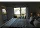Bedroom view leading to the screened porch and lake at 19505 Quesada Ave # Bb-103, Port Charlotte, FL 33948