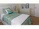 Comfortable bedroom with white furniture and stylish bedding at 19505 Quesada Ave # Bb-103, Port Charlotte, FL 33948