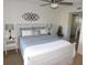 Main bedroom with stylish decor, ceiling fan, and closet at 19505 Quesada Ave # Bb-103, Port Charlotte, FL 33948