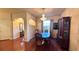 The dining room features hardwood floors, a chandelier, and a view into the front yard at 2158 Fentress Ct, Spring Hill, FL 34609