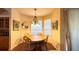 Dining room boasts a chandelier, bright windows, and neutral paint at 2158 Fentress Ct, Spring Hill, FL 34609