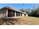 The home features a spacious backyard and a screened-in patio for outdoor enjoyment at 2158 Fentress Ct, Spring Hill, FL 34609