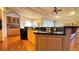 Open kitchen with granite countertops, wood cabinets, and stainless steel appliances at 2158 Fentress Ct, Spring Hill, FL 34609