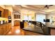 Open kitchen with granite countertops, wood cabinets, and stainless steel appliances at 2158 Fentress Ct, Spring Hill, FL 34609