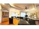 Spacious kitchen features wood cabinets, granite countertops, stainless steel appliances, and center island at 2158 Fentress Ct, Spring Hill, FL 34609