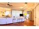 Living room with neutral paint, tray ceiling, and wood floors at 2158 Fentress Ct, Spring Hill, FL 34609