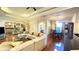 Open floor plan with spacious living room with chandelier, dining area, and kitchen at 2158 Fentress Ct, Spring Hill, FL 34609