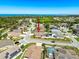 High aerial view of the house in the neighborhood near the trees and distant water views at 2634 Ravendale Ln, Holiday, FL 34691