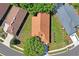 Stunning aerial view of the home showing the roof, mature trees, and well-manicured lawn at 303 Rochester St, Spring Hill, FL 34609
