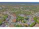 Expansive aerial view of the Wellington community, showcasing the lush landscaping and the neighborhood layout at 303 Rochester St, Spring Hill, FL 34609