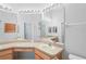 Bathroom featuring double sinks, mirrors, and recessed lighting at 303 Rochester St, Spring Hill, FL 34609