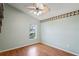 Smaller bedroom featuring hardwood floors and a ceiling fan at 303 Rochester St, Spring Hill, FL 34609
