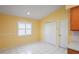 Dining area featuring a window with white shutters at 303 Rochester St, Spring Hill, FL 34609