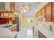 Bright eat-in kitchen with stainless steel appliances and a window providing natural light at 303 Rochester St, Spring Hill, FL 34609