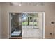 Bright sunroom with vinyl floors and large glass windows and sliding glass door at 303 Rochester St, Spring Hill, FL 34609