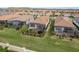 Aerial view of backyards, highlighting the patio and lush greenery creating a relaxing outdoor oasis at 3056 Francoa Dr, Odessa, FL 33556