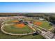 Aerial view of the community sports complex, featuring baseball fields, parking, and recreation areas at 3056 Francoa Dr, Odessa, FL 33556