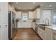 This kitchen features white cabinets and stainless steel appliances at 3056 Francoa Dr, Odessa, FL 33556