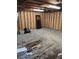 Unfinished basement with exposed wood frame and concrete floor offering potential for customization at 315 Highland St, Brooksville, FL 34601