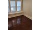 Bedroom featuring hardwood floors, large window and natural light at 315 Highland St, Brooksville, FL 34601